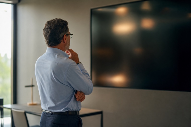 An operations manager reviewing a live operations display